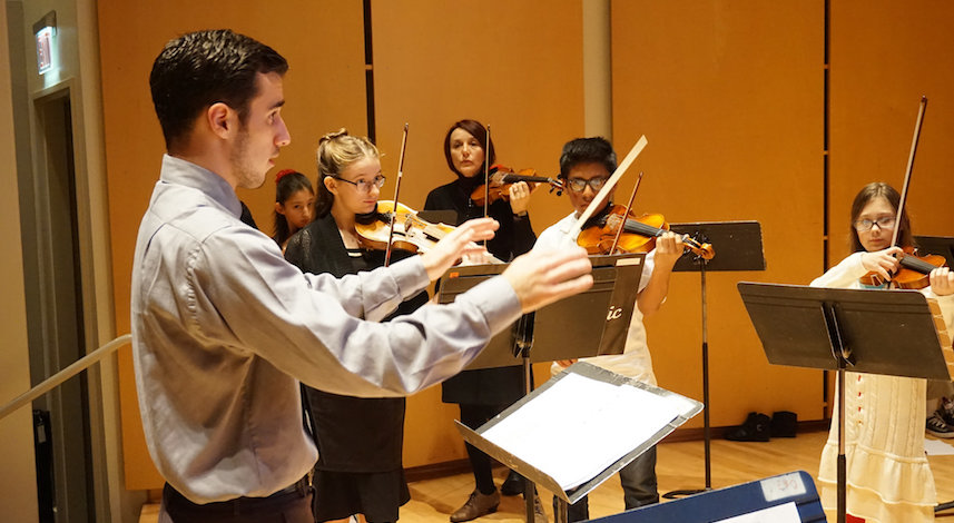 student teacher conducting students