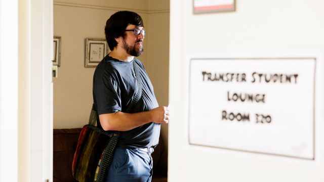 A transfer student enters the Transfer Student Lounge at Pacific University